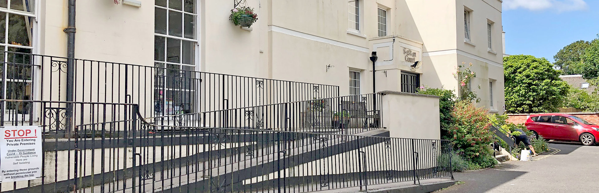Three-tier ramp to the front entrance of the scheme from off the carpark