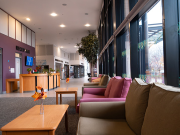 A side view of the reception area looking down the corridor from some soft seating