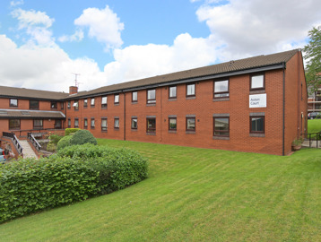 Rear garden with large grass area and steps leading up to the scheme