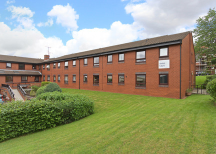 Rear garden with large grass area and steps leading up to the scheme