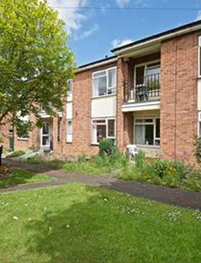 A photo of the side of the building and garden area at Devonshire Court 