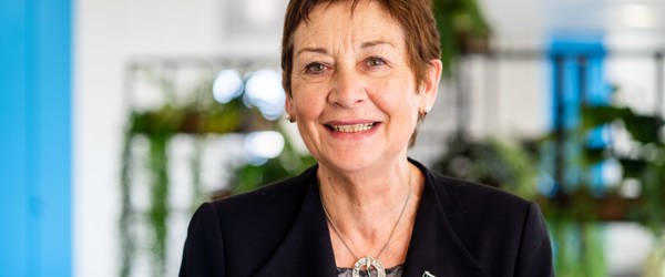 Chair of the Board Elaine Elkington smiles at the camera 