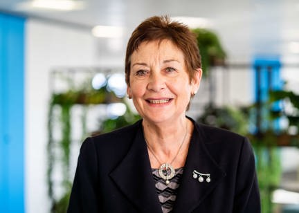 Chair of the Board Elaine Elkington smiles at the camera
