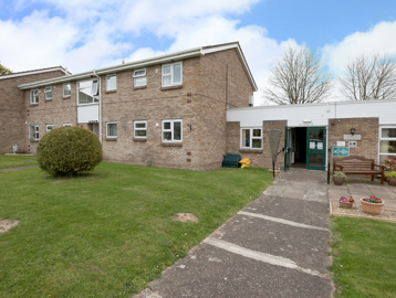 Entrance area with ramp ascending to doorway