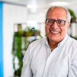Housing 21 Board Member, Suki Kalirai, smiles into the camera