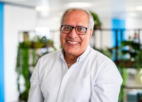 Board Member Suki Kalirai smiles at the camera