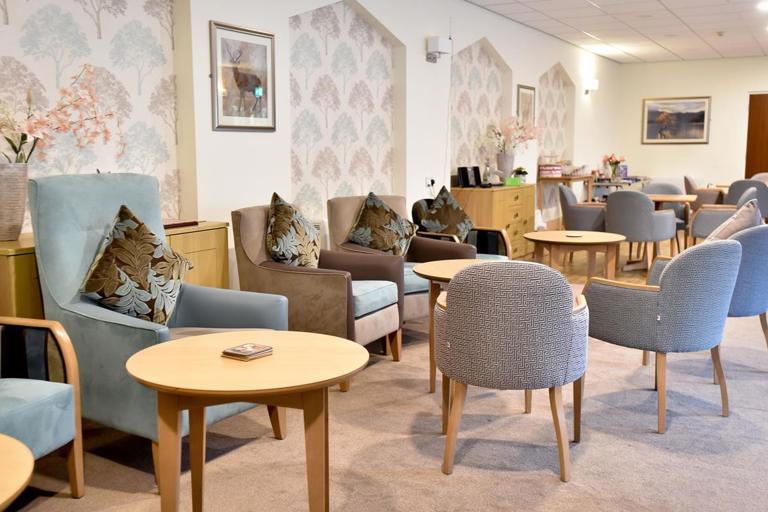 Comfortable seating and tables in lounge at Alan Hilton Court
