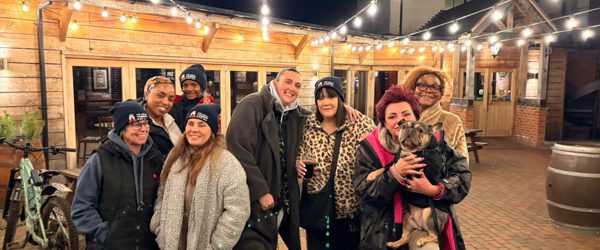 People in wolly hats prepare for a sleep out
