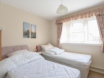 Two single beds in the bedroom of an apartment