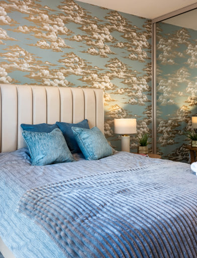 Inside the master bedroom of the show apartment at Glen Mill House with a double bed and furnishings 