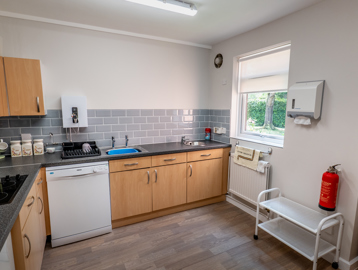 William Griffiths Court internal shot: A kitchen suite with a dishwasher, hob, and smart kitchen cupboards