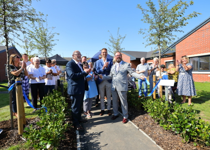 Residents and employees of Housing 21 at the ribbon cutting for Patent House scheme in Doncaster. 
