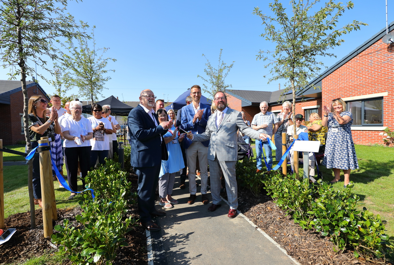Residents and employees of Housing 21 at the ribbon cutting for Patent House scheme in Doncaster. 