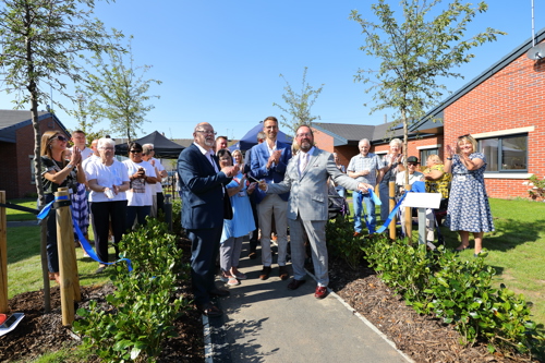 Residents and employees of Housing 21 at the ribbon cutting for Patent House scheme in Doncaster.
