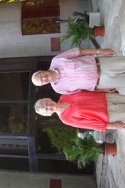 a couple in front of a building