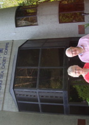 a couple in front of a building