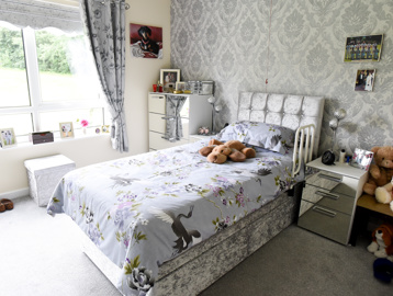 A single bedroom inside a resident's apartment