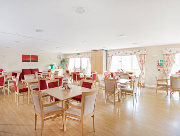 Red and cream coloured communal dining room