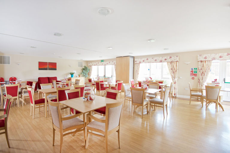 Red and cream coloured communal dining room