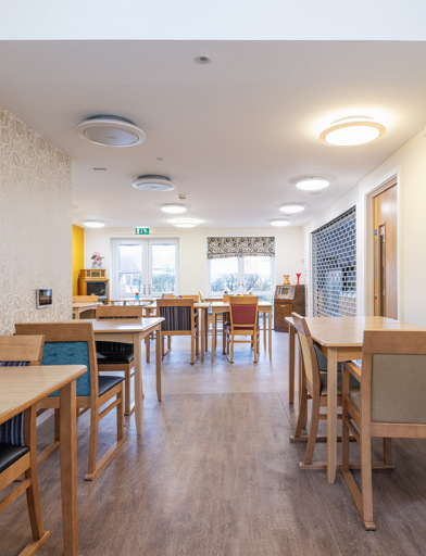 A dining area with tables and chairs 