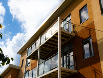 Looking up at some balconies on a bright day with blue skies