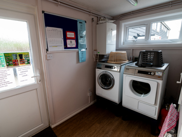 Small laundry room with a washing machine and dryer