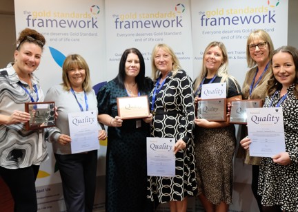 Housing 21 employees holding certificates for achieving Gold Standards Framework’s Quality Hallmark Award.
