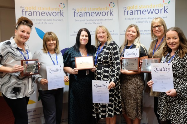 Housing 21 employees holding certificates for achieving Gold Standards Framework’s Quality Hallmark Award.