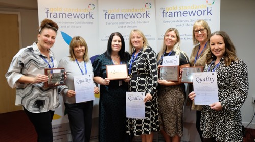 Housing 21 employees holding certificates for achieving Gold Standards Framework’s Quality Hallmark Award.