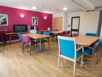 Communal seating area with dining tables and chairs