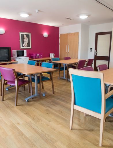 Communal seating area with dining tables and chairs