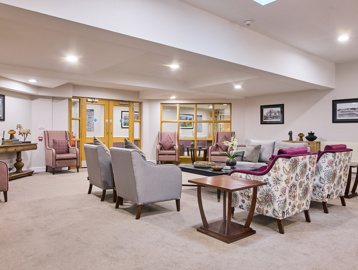 the scheme communal area with tables and chairs