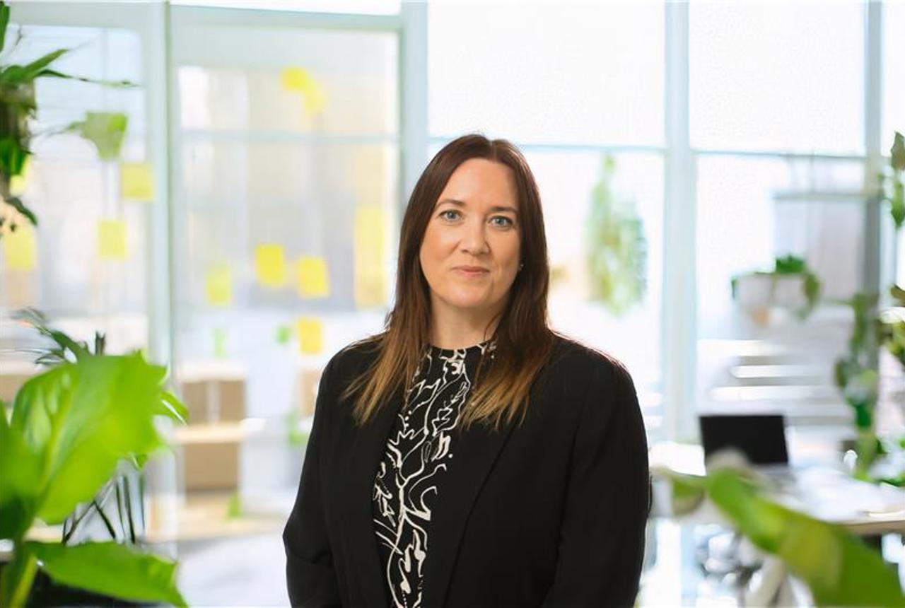 Lady in black outfit smiling
