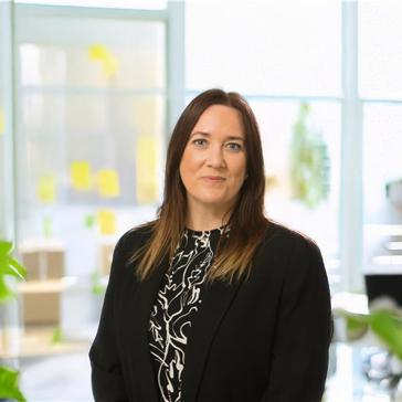 Lady in black outfit smiling