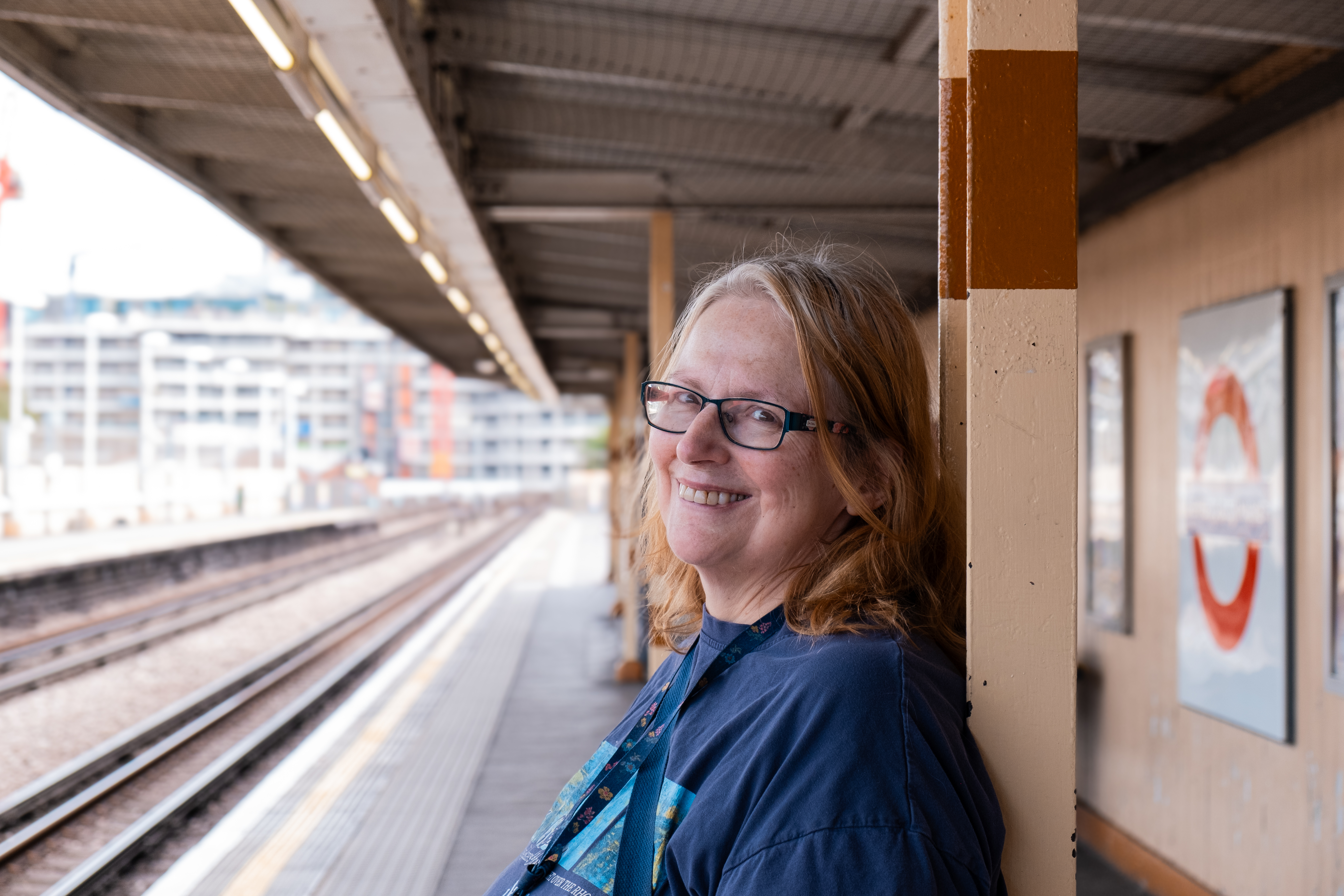 Jane, a resident at Minterne Apartments smiling into camera waiting for the underground