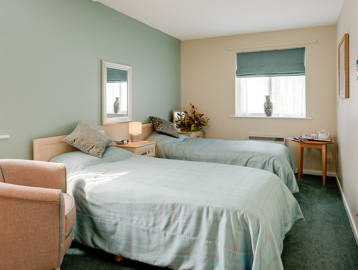 Two single beds in the bedroom of an apartment