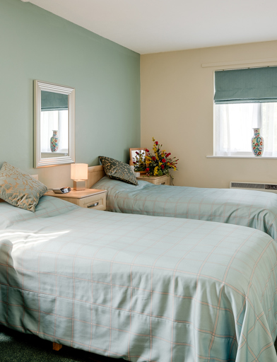 Two single beds in the bedroom of an apartment 