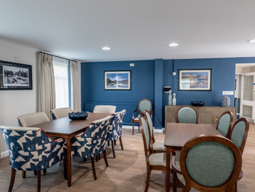 William Griffiths Court internal shot: Communal seating area with dining tables and chairs