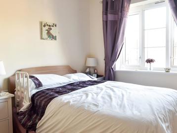Double bedroom in a resident's apartment