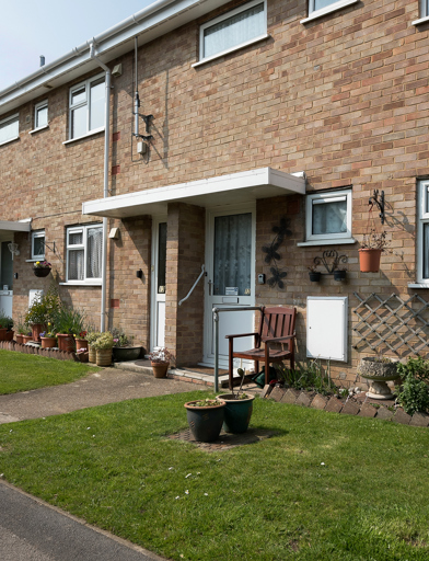 Front gardens, plant pots and seating outside of resident's homes 