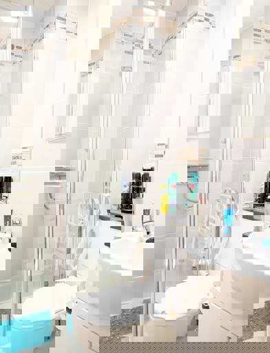 Accessible shower inside bathroom of residents apartment