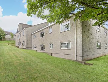 Outside of the scheme at Nicholson Court surrounded by a large grassed area