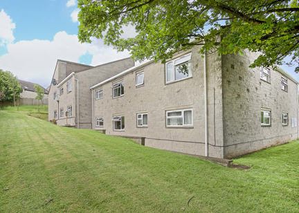 Outside of the scheme at Nicholson Court surrounded by a large grassed area