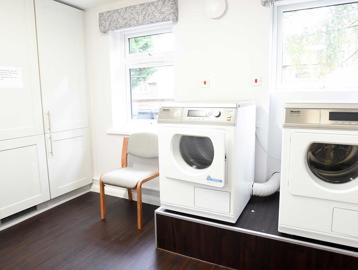 Two appliances in the laundry room at Goodman Court