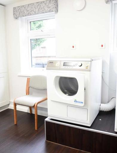 Two appliances in the laundry room at Goodman Court 