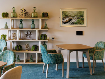 Detailed view of stylish furnishings in communal lounge at Green Lane View