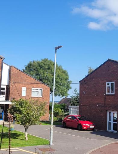 A photo of the outside area of Goodman Court with car parking spaces 