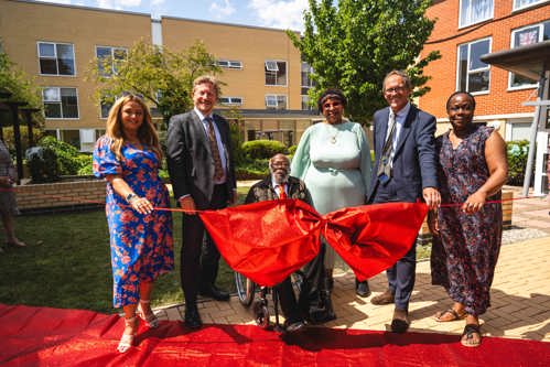 Resident Alvin ahead of the ribbon cutting with representatives from Housing 21.