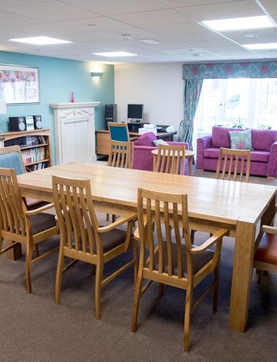 Open-plan communal lounge, kitchen and dining area for residents 
