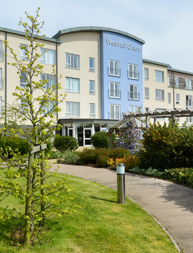Curved path leading through the front garden to the entrance of Westhall Court 